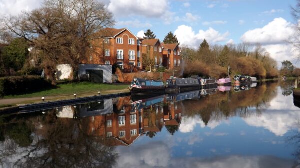 Reflections of buildings and boats on the Grand Union Canal