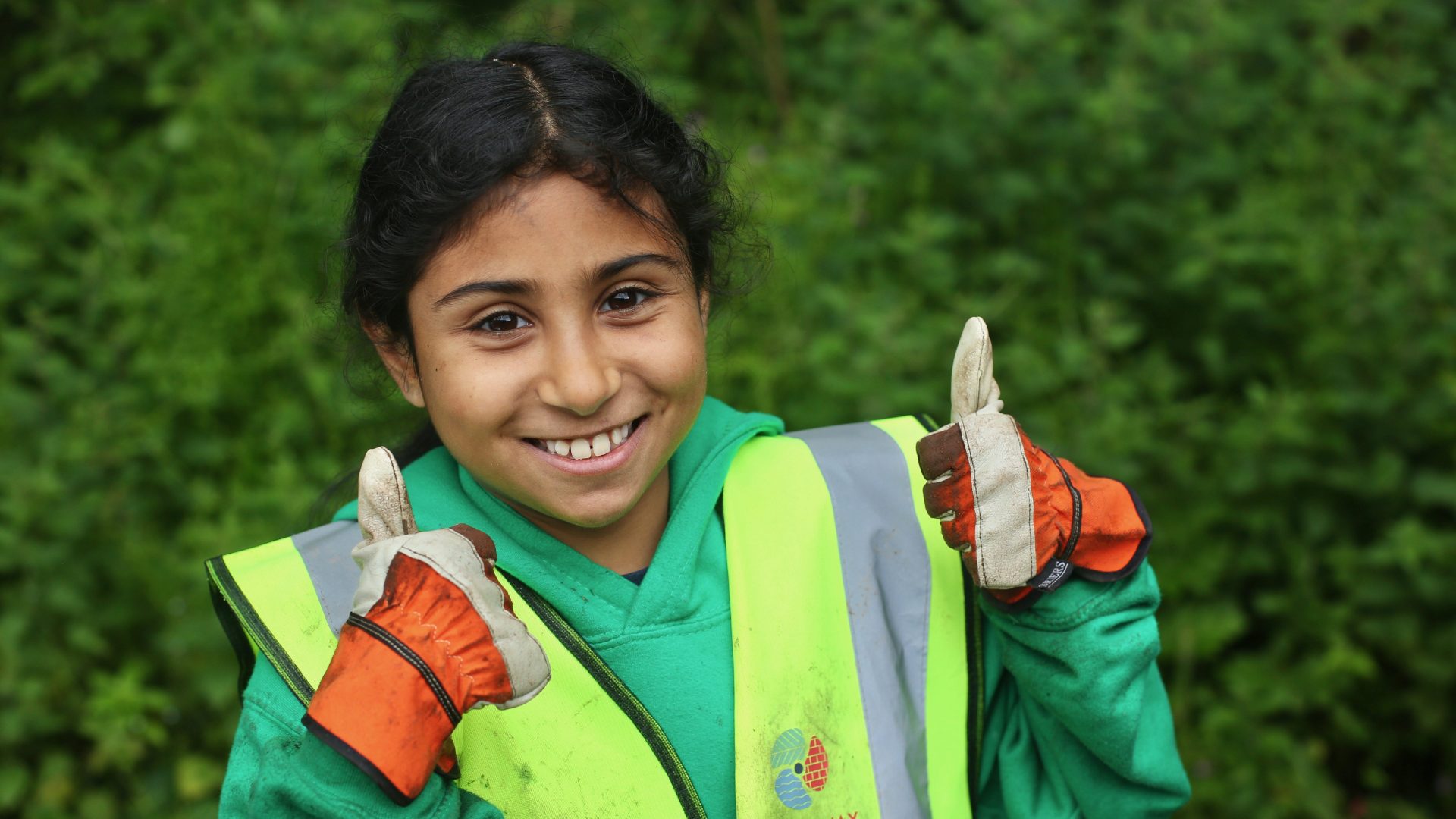 Young person with thumbs up