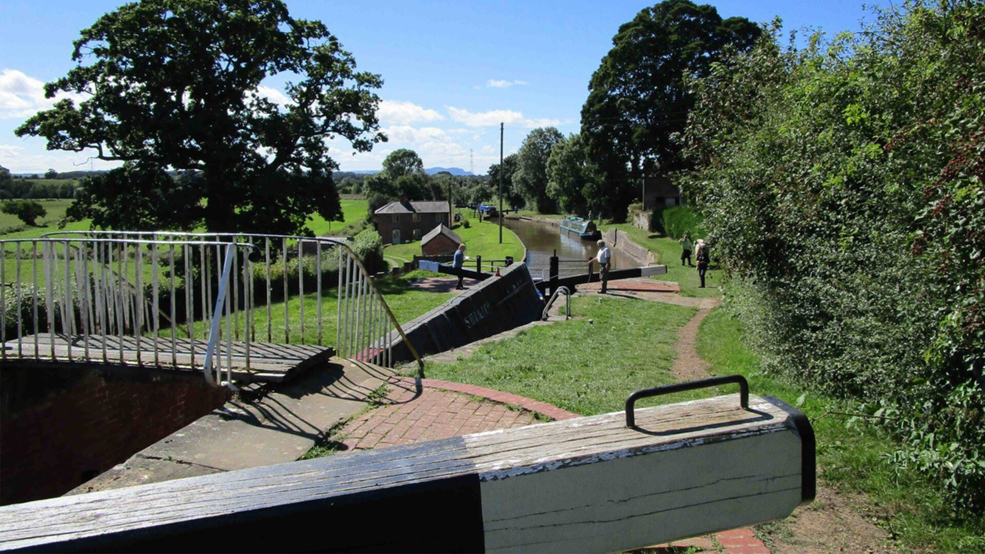 Historic boat descending through a lock flight