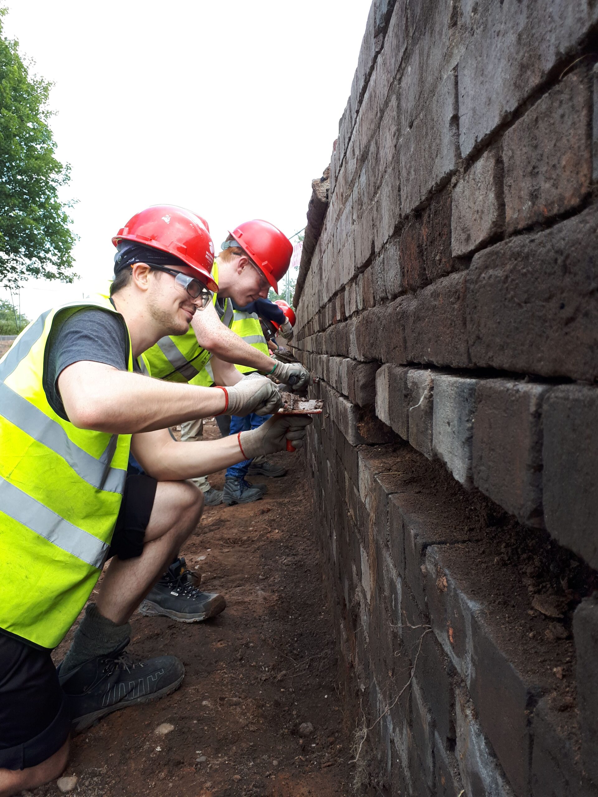 Volunteers bricklaying