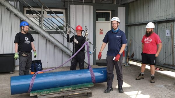 Volunteers learning how to safely lift using slings