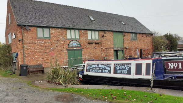 Shardlow warehouse B with narrowboat moored in front of it