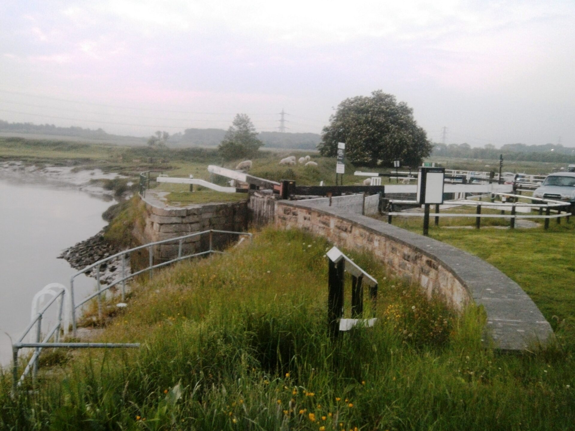 canal lock opening onto a river