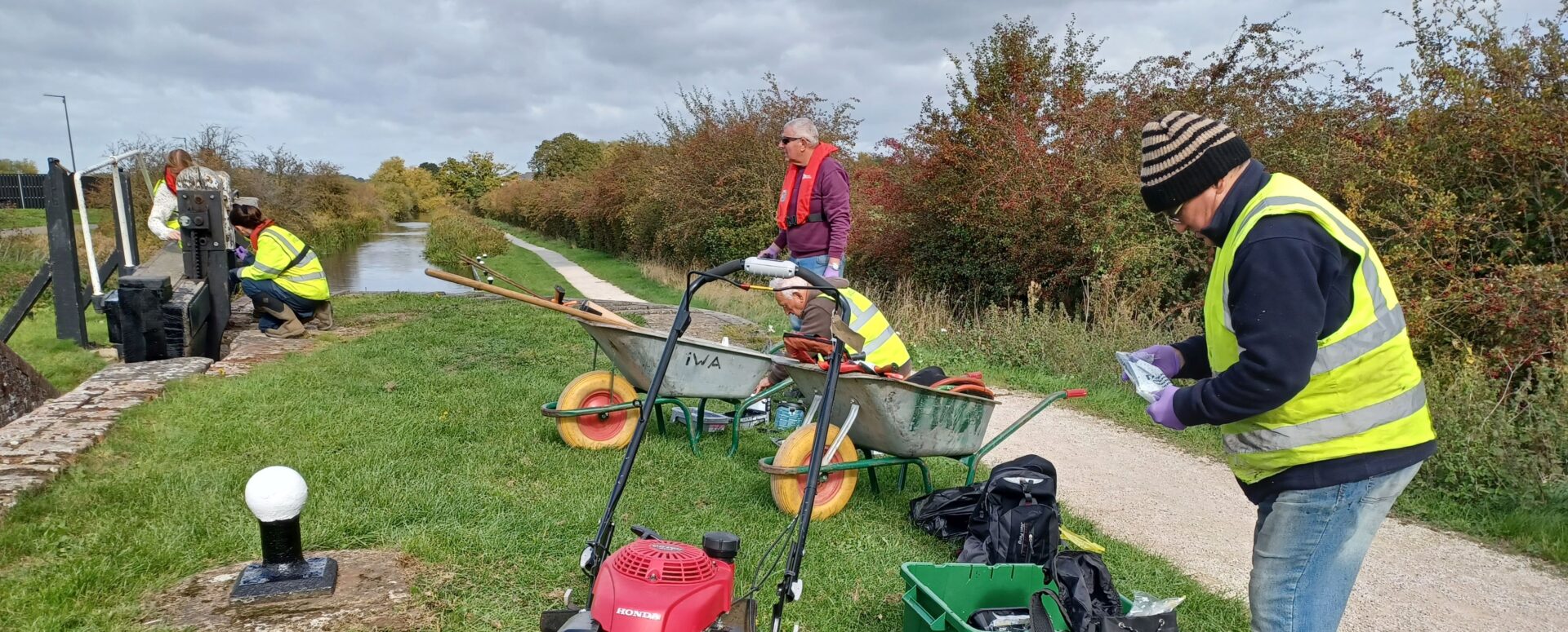 Men and mowers, grass cutting