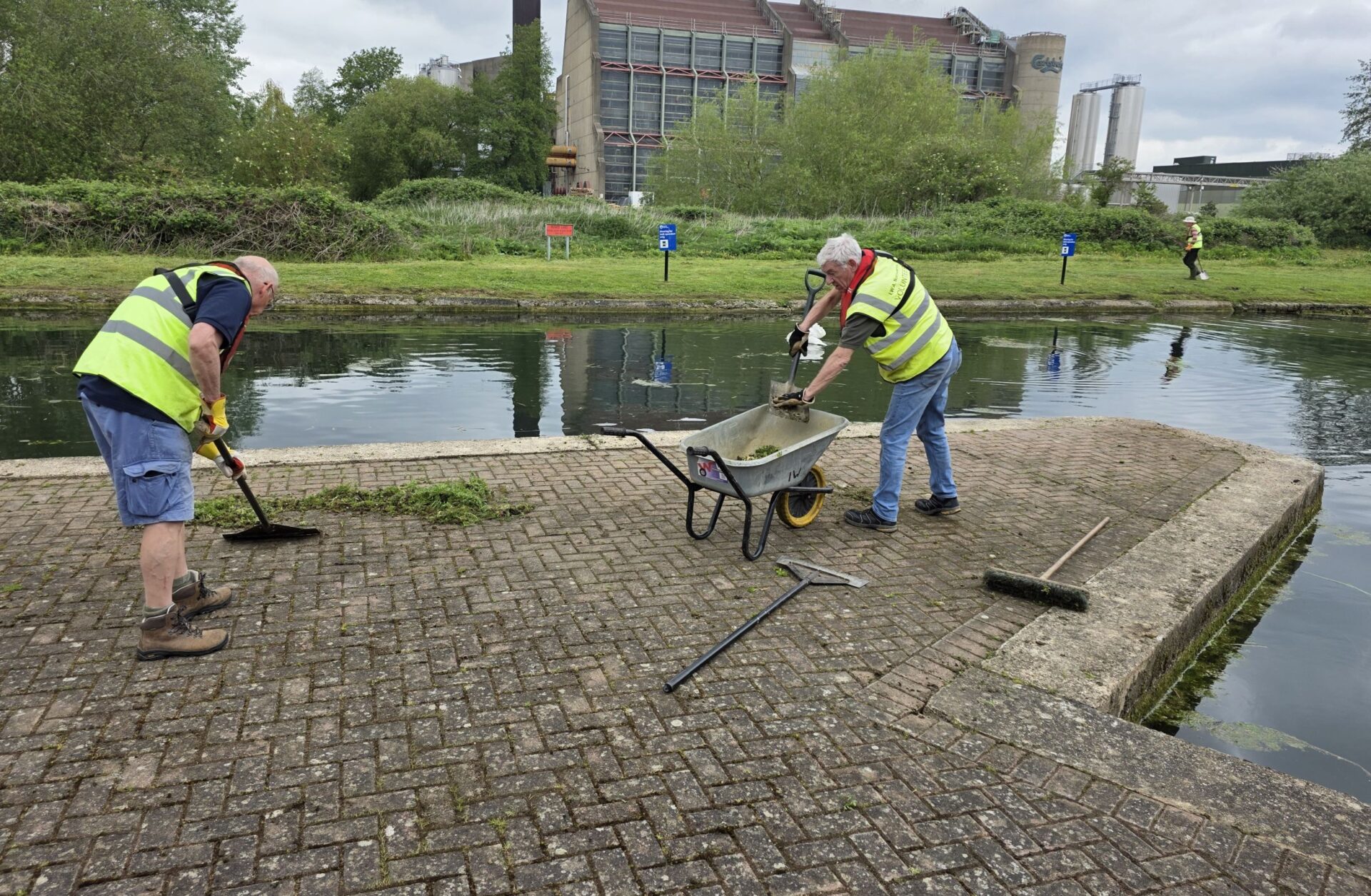 clearing weeds from area above lock 17